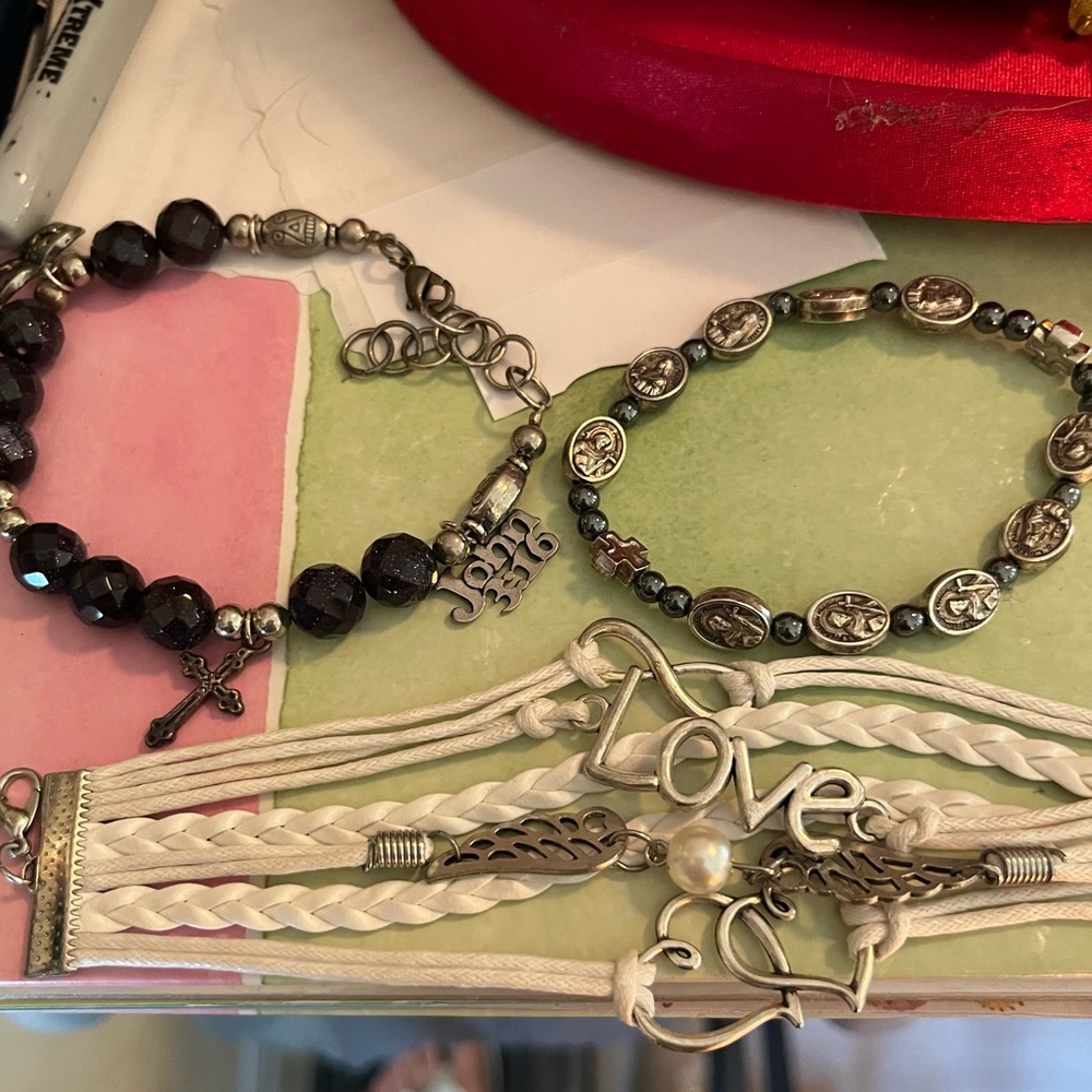 3 bracelets, 1 pendant, 1ring! Bracelet from Israel has saints on it , a purple